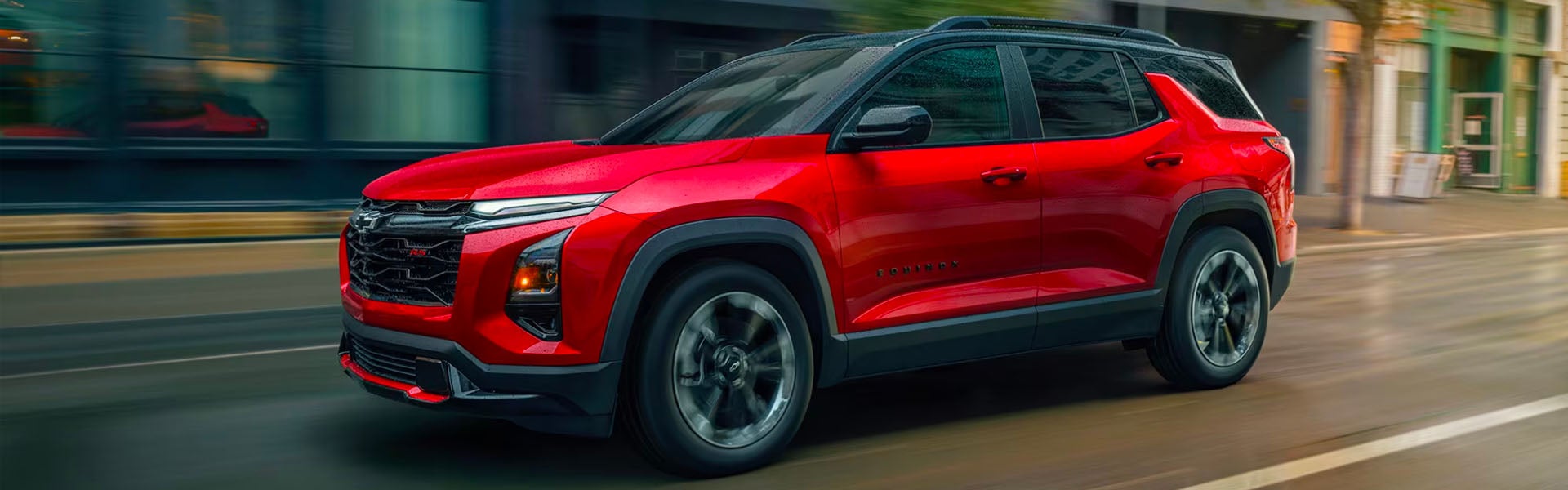 2026 Chevrolet Equinox red SUV driving on road