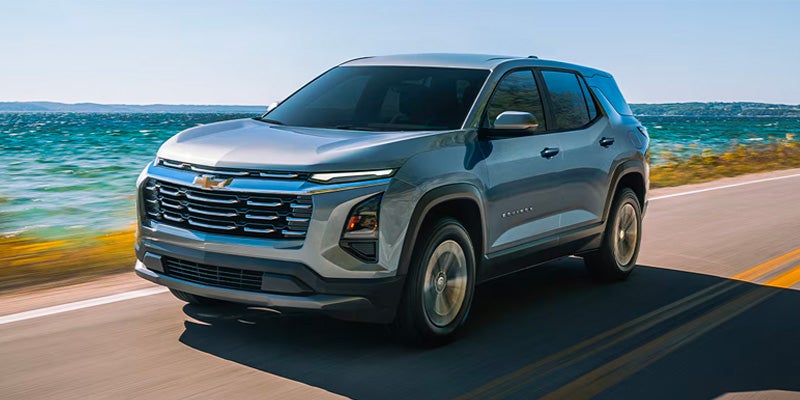 2026 Chevrolet Equinox SUV driving along coastal road
