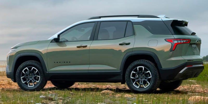 2026 Chevrolet Equinox ACTIV SUV side view on outdoor terrain