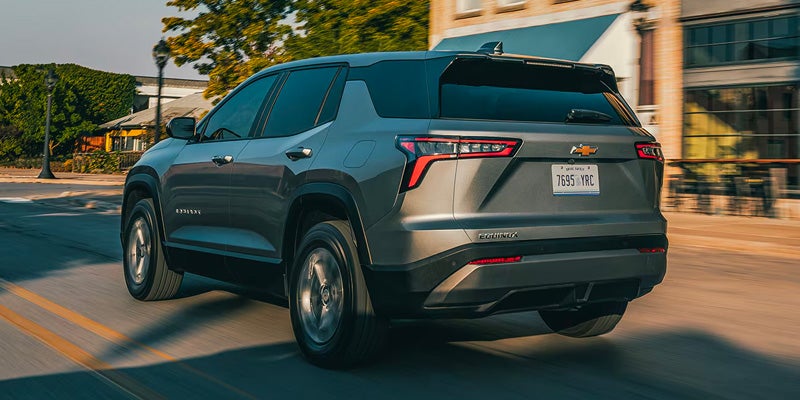 2026 Chevrolet Equinox SUV rear view driving on city road