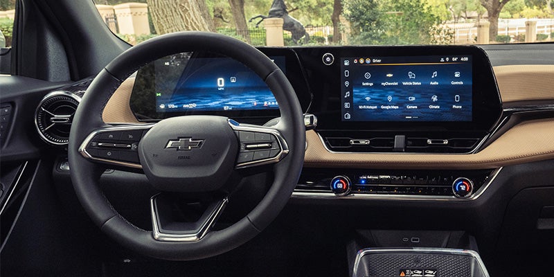 Chevrolet Equinox interior with digital dashboard, steering wheel, and touchscreen display.
